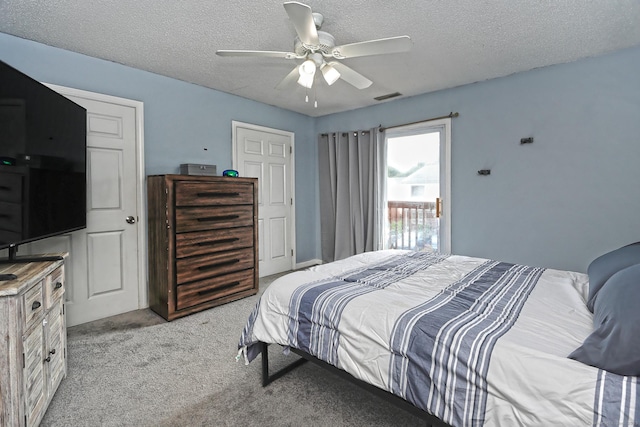 330 Short Beach Rd Apt G13, East Haven, CT 06512 - bedroom featuring a textured ceiling, light carpet, and ceiling fan