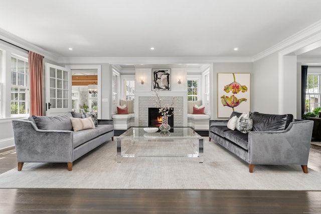 336 Ocean Dr W, Stamford, CT 06902 - living area with wood finished floors, crown molding, a premium fireplace, and recessed lighting