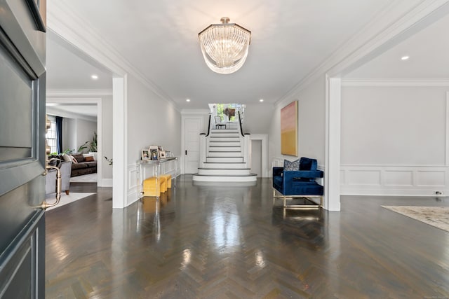 336 Ocean Dr W, Stamford, CT 06902 - entrance foyer featuring stairway, ornamental molding, a chandelier, recessed lighting, and a decorative wall