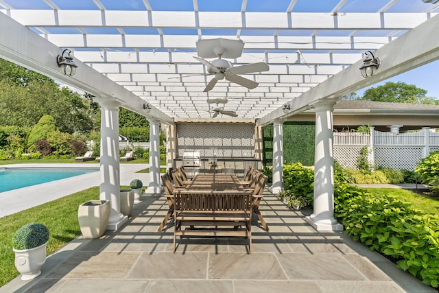 336 Ocean Dr W, Stamford, CT 06902 - view of patio / terrace featuring a ceiling fan, a pergola, an outdoor pool, and an outdoor kitchen