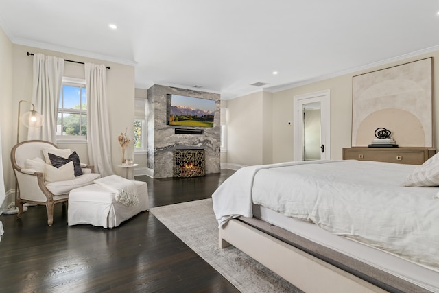 336 Ocean Dr W, Stamford, CT 06902 - bedroom with ornamental molding, wood finished floors, a fireplace, and recessed lighting