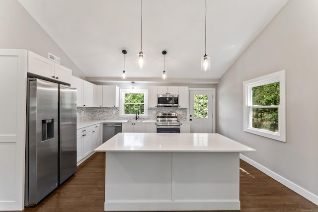 33 Williams Rd, Monroe, CT 06468 - kitchen featuring appliances with stainless steel finishes, lofted ceiling, decorative backsplash, white cabinets, and light countertops