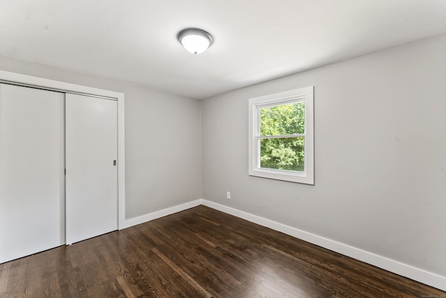 33 Williams Rd, Monroe, CT 06468 - unfurnished bedroom with dark wood-type flooring and a closet