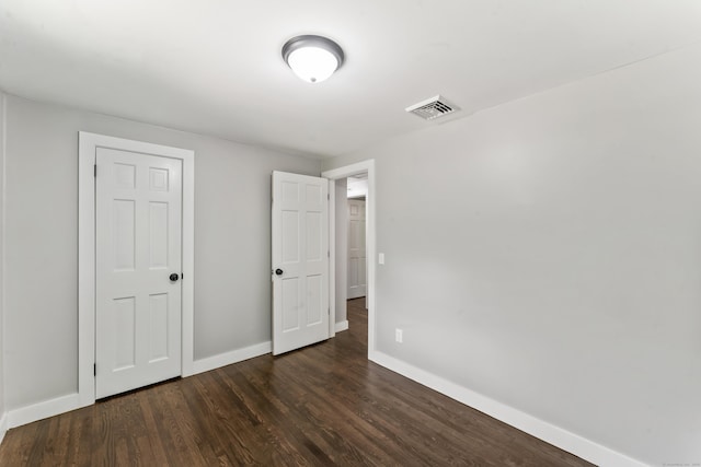 33 Williams Rd, Monroe, CT 06468 - unfurnished bedroom with baseboards and dark wood-type flooring