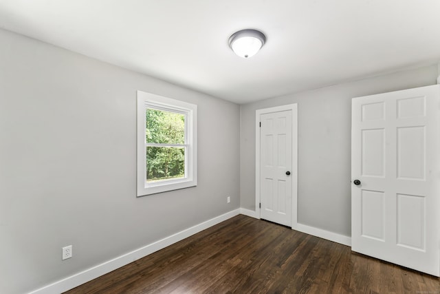 33 Williams Rd, Monroe, CT 06468 - unfurnished bedroom with dark wood-style flooring and a closet