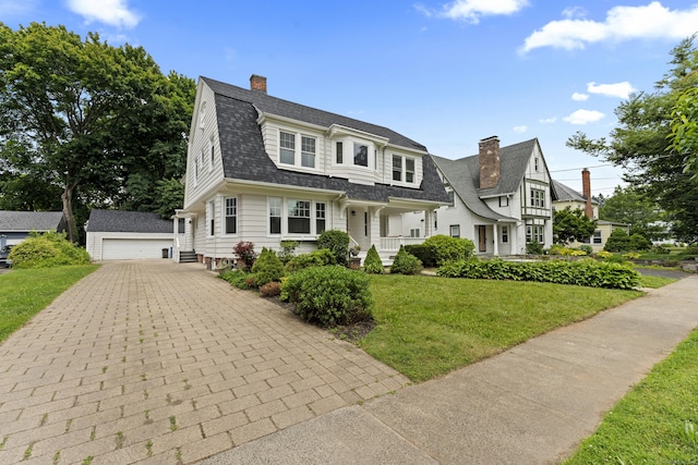 119 Westwood Rd, New Haven, CT 06515 - view of front of house featuring a detached garage, an outbuilding, a chimney, a gambrel roof, and a front yard