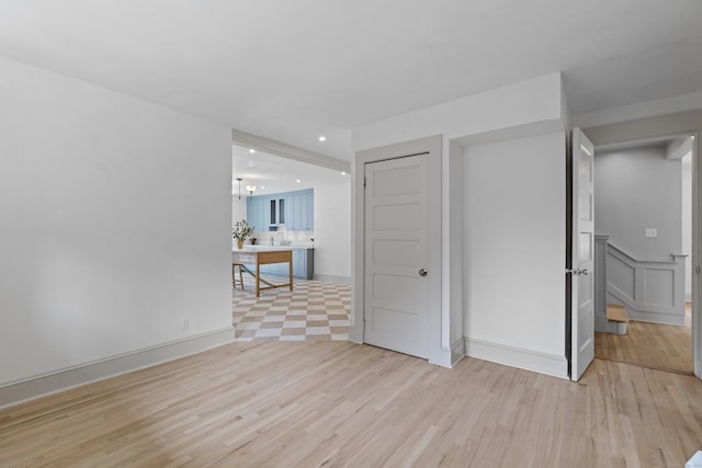 119 Westwood Rd, New Haven, CT 06515 - unfurnished living room with light wood-style floors and recessed lighting