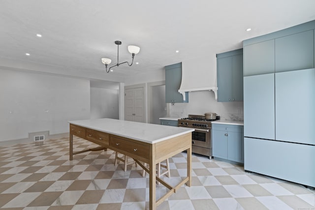119 Westwood Rd, New Haven, CT 06515 - kitchen featuring stainless steel range, freestanding refrigerator, light floors, light countertops, and custom exhaust hood
