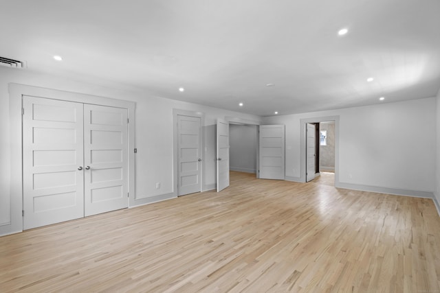 119 Westwood Rd, New Haven, CT 06515 - unfurnished living room with light wood finished floors and recessed lighting