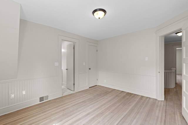 119 Westwood Rd, New Haven, CT 06515 - spare room with wood finished floors and a wainscoted wall