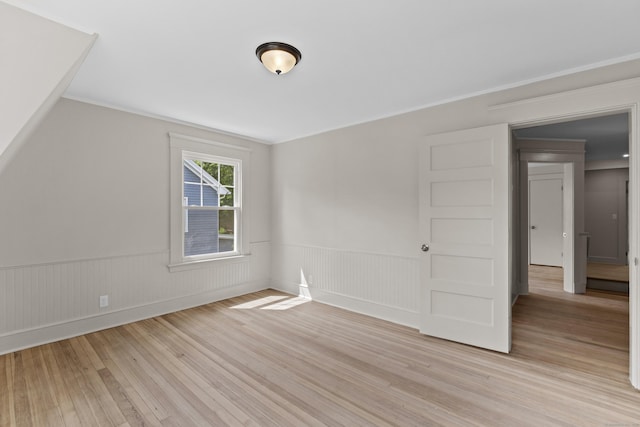 119 Westwood Rd, New Haven, CT 06515 - unfurnished bedroom with light wood-style floors and a wainscoted wall