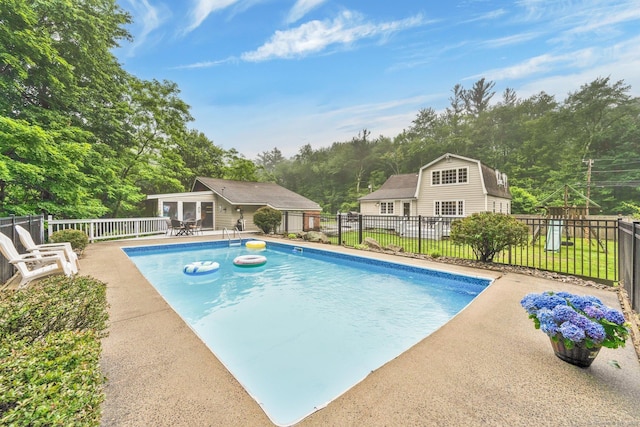 268 Hattertown Rd, Monroe, CT 06468 - view of swimming pool featuring a storage structure, an outbuilding, a patio area, and view of scattered trees