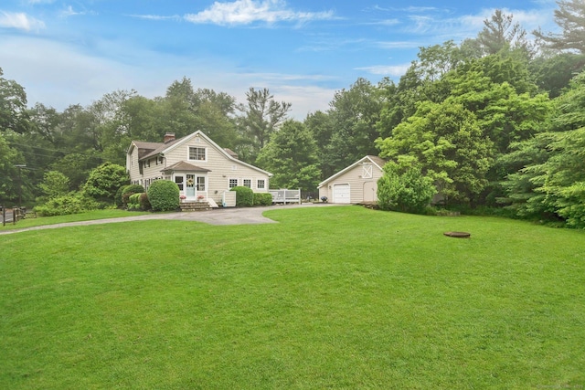 268 Hattertown Rd, Monroe, CT 06468 - view of front of home with an outbuilding, a chimney, a detached garage, and a front lawn