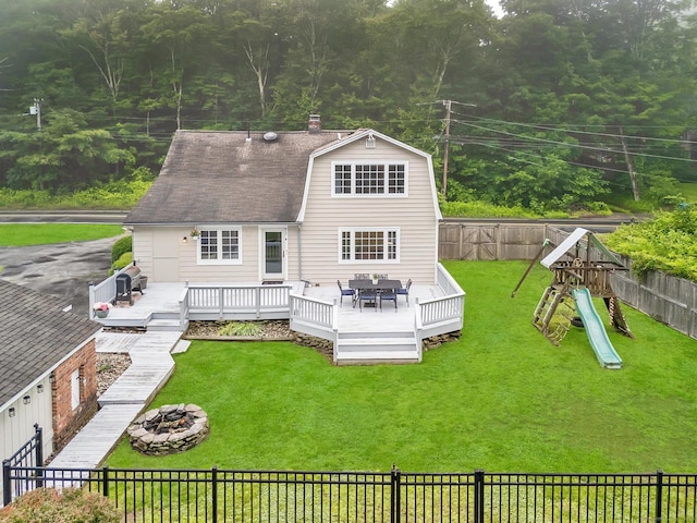 268 Hattertown Rd, Monroe, CT 06468 - rear view of property with an outdoor fire pit, a fenced backyard, a deck, and a playground