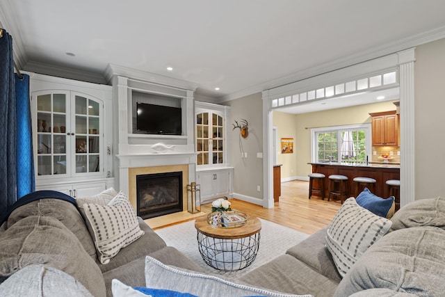 28 Hoop Pole Hill Rd, Chester, CT 06412 - living room featuring light wood finished floors, ornamental molding, a fireplace with flush hearth, and recessed lighting