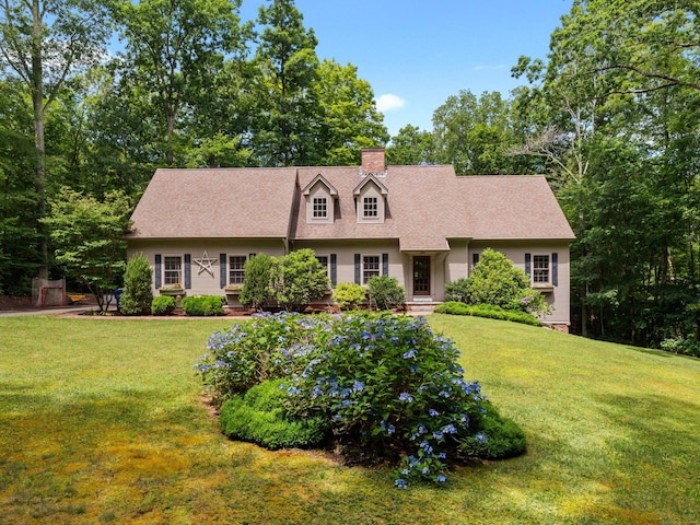28 Hoop Pole Hill Rd, Chester, CT 06412 - cape cod-style house featuring a front lawn, a chimney, a shingled roof, and view of wooded area