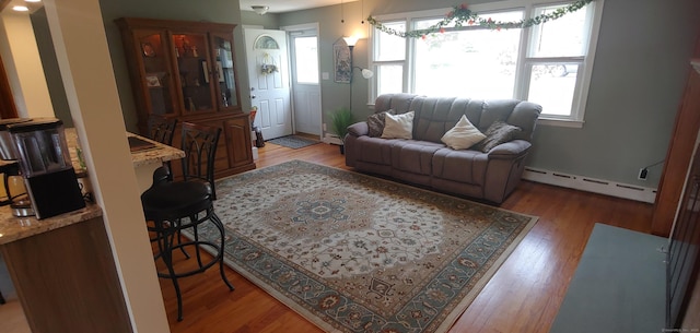 92 Sumac St, West Haven, CT 06516 - living room featuring baseboard heating and wood finished floors