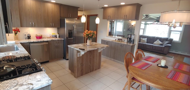92 Sumac St, West Haven, CT 06516 - kitchen with appliances with stainless steel finishes, backsplash, recessed lighting, ceiling fan, and decorative light fixtures