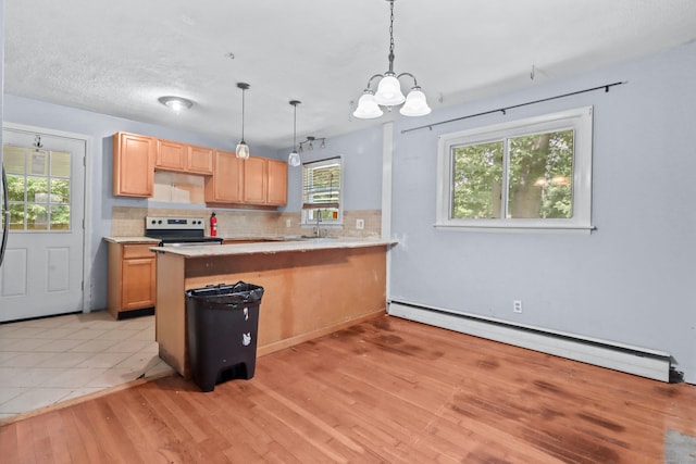 31 Richard Rd, Ledyard, CT 06335 - kitchen featuring baseboard heating, stainless steel electric range oven, decorative backsplash, light wood-style flooring, and a chandelier