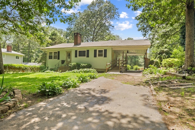31 Richard Rd, Ledyard, CT 06335 - view of front facade with a chimney, an attached carport, a front lawn, and entry steps