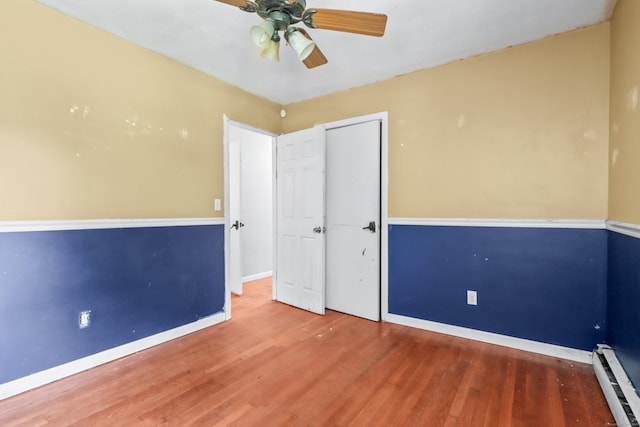 31 Richard Rd, Ledyard, CT 06335 - unfurnished bedroom with baseboard heating, wood finished floors, ceiling fan, and a closet