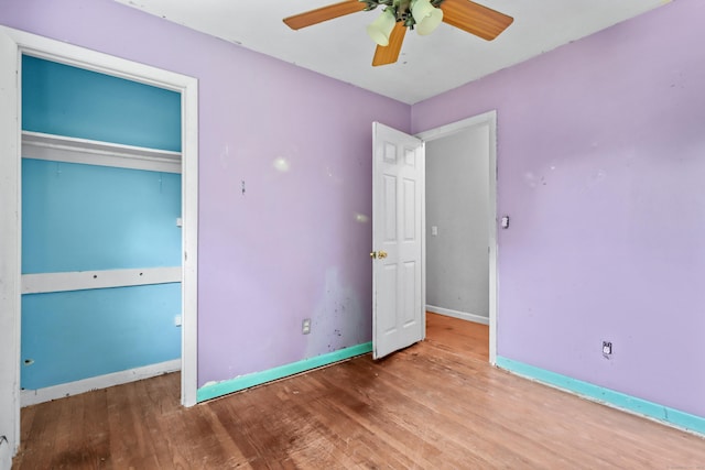 31 Richard Rd, Ledyard, CT 06335 - unfurnished bedroom featuring wood finished floors, a ceiling fan, and a closet