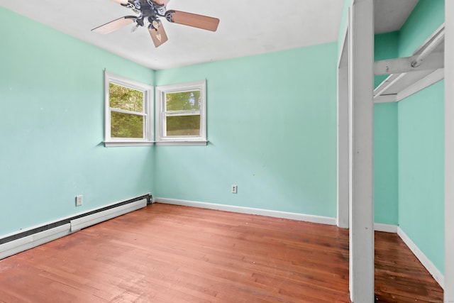 31 Richard Rd, Ledyard, CT 06335 - unfurnished bedroom featuring a baseboard heating unit, wood-type flooring, and ceiling fan