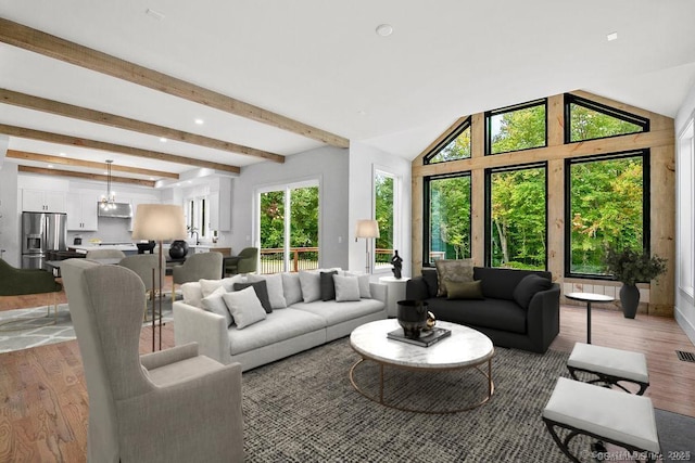 4B Vona Way, Newtown, CT 06470 - living area with light wood finished floors, recessed lighting, and beamed ceiling