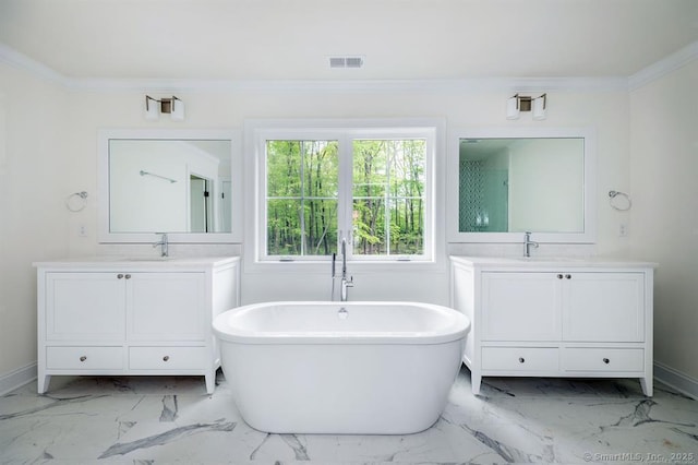 4B Vona Way, Newtown, CT 06470 - bathroom with marble finish floors, two vanities, a freestanding bath, and ornamental molding