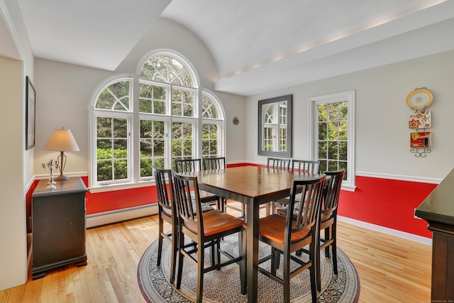 344 Oxbow Rd, Haddam, CT 06422 - dining room featuring a baseboard heating unit, vaulted ceiling, and light wood-type flooring