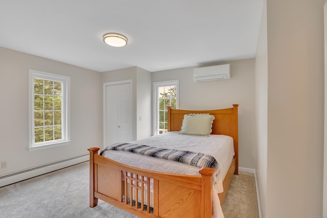 344 Oxbow Rd, Haddam, CT 06422 - bedroom with an AC wall unit, light carpet, a baseboard radiator, and multiple windows