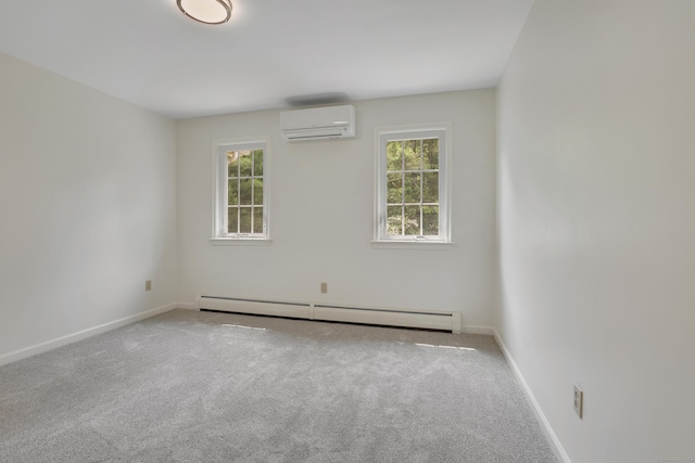 344 Oxbow Rd, Haddam, CT 06422 - carpeted spare room with a wall mounted AC, a baseboard heating unit, and healthy amount of natural light