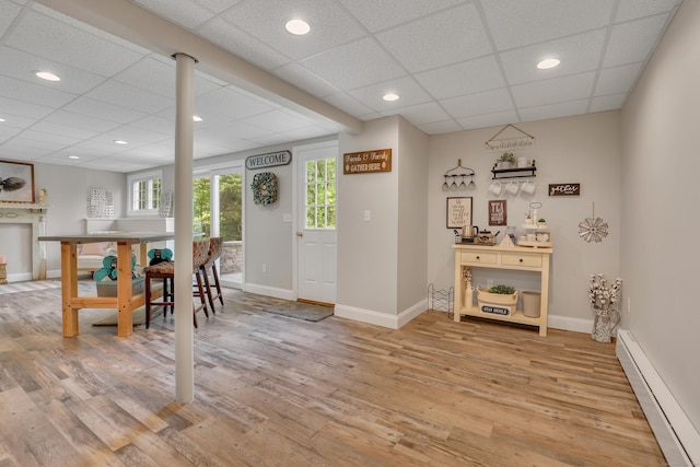 344 Oxbow Rd, Haddam, CT 06422 - dining area with a baseboard heating unit, a drop ceiling, light wood-type flooring, and recessed lighting