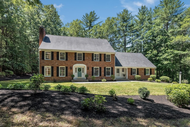 5 Billingsgate, Avon, CT 06001 - colonial inspired home featuring a chimney, a front yard, and brick siding