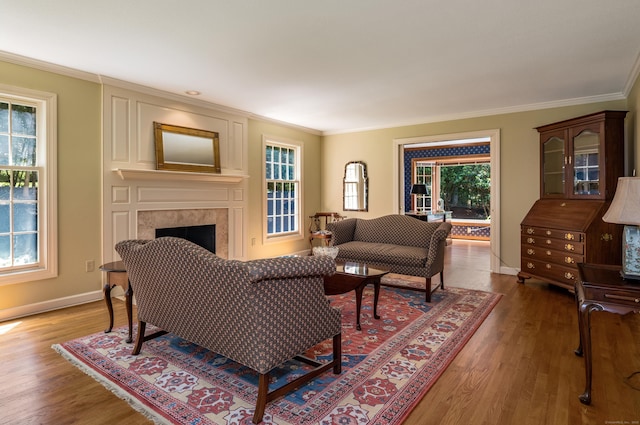 5 Billingsgate, Avon, CT 06001 - living room featuring crown molding, plenty of natural light, a high end fireplace, and wood finished floors