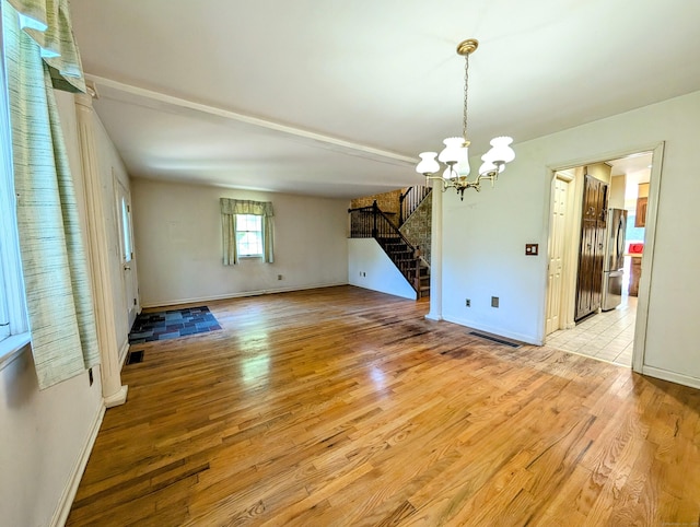 148A Westville Avenue Extension, Danbury, CT 06811 - spare room with stairway, a chandelier, and light wood-type flooring