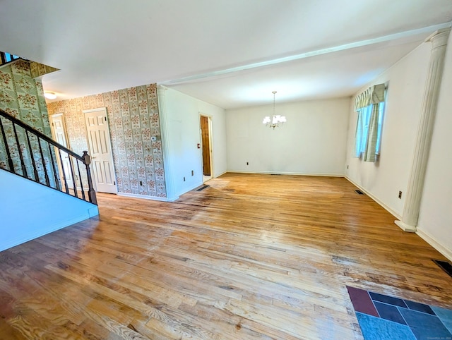 148A Westville Avenue Extension, Danbury, CT 06811 - unfurnished room featuring a chandelier, stairway, wallpapered walls, and wood finished floors