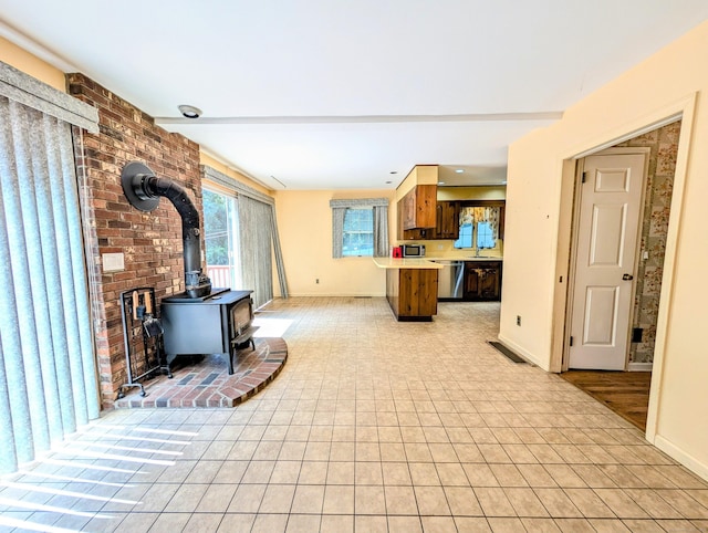 148A Westville Avenue Extension, Danbury, CT 06811 - living area with a wood stove and light tile patterned flooring