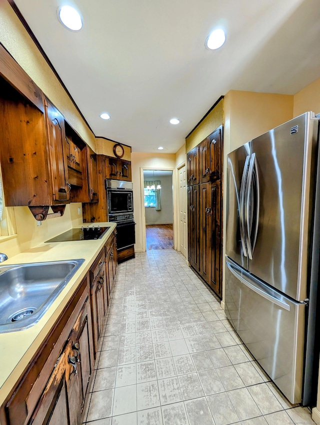148A Westville Avenue Extension, Danbury, CT 06811 - kitchen with black appliances, light countertops, and recessed lighting