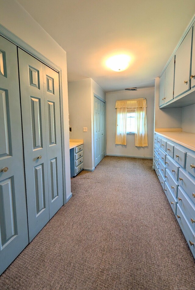 148A Westville Avenue Extension, Danbury, CT 06811 - unfurnished bedroom featuring light colored carpet and two closets