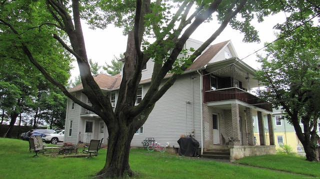 195 E Pearl St, Torrington, CT 06790 - back of property featuring a balcony and a yard