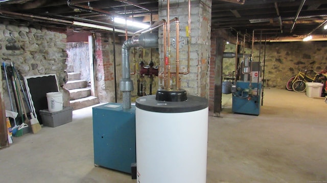 195 E Pearl St, Torrington, CT 06790 - unfinished below grade area with water heater and a heating unit