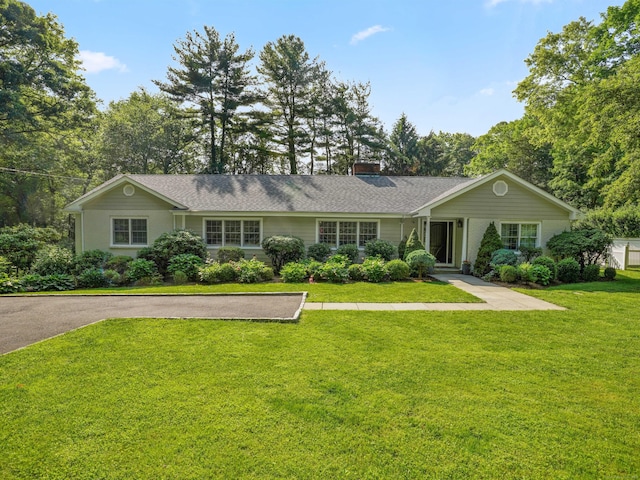 566 Hoyt St, Darien, CT 06820 - ranch-style home with a front yard and a chimney