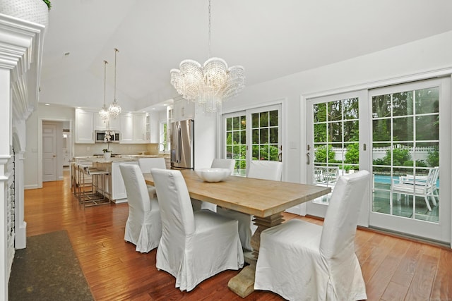 566 Hoyt St, Darien, CT 06820 - dining room featuring a chandelier, wood-type flooring, and high vaulted ceiling