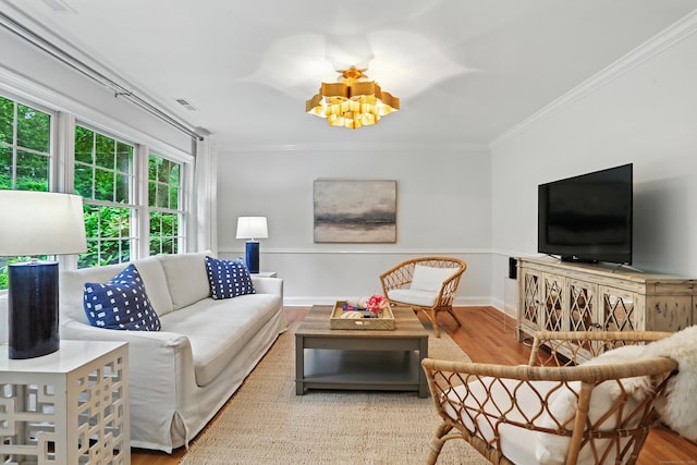 566 Hoyt St, Darien, CT 06820 - living room featuring crown molding, wood finished floors, and a chandelier