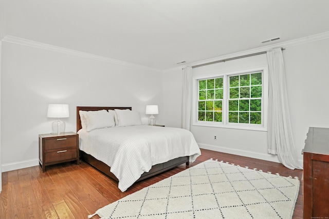 566 Hoyt St, Darien, CT 06820 - bedroom with crown molding and dark wood-style floors