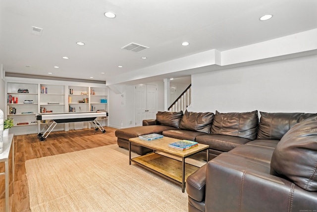 566 Hoyt St, Darien, CT 06820 - living area featuring recessed lighting, light wood-style floors, and stairway