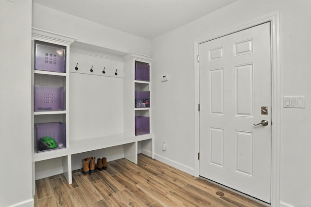 566 Hoyt St, Darien, CT 06820 - mudroom featuring wood finished floors and baseboards