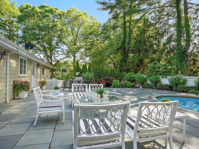 566 Hoyt St, Darien, CT 06820 - fenced backyard featuring a patio and outdoor dining area