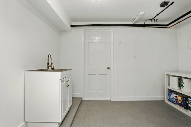 566 Hoyt St, Darien, CT 06820 - laundry room featuring a sink and baseboards